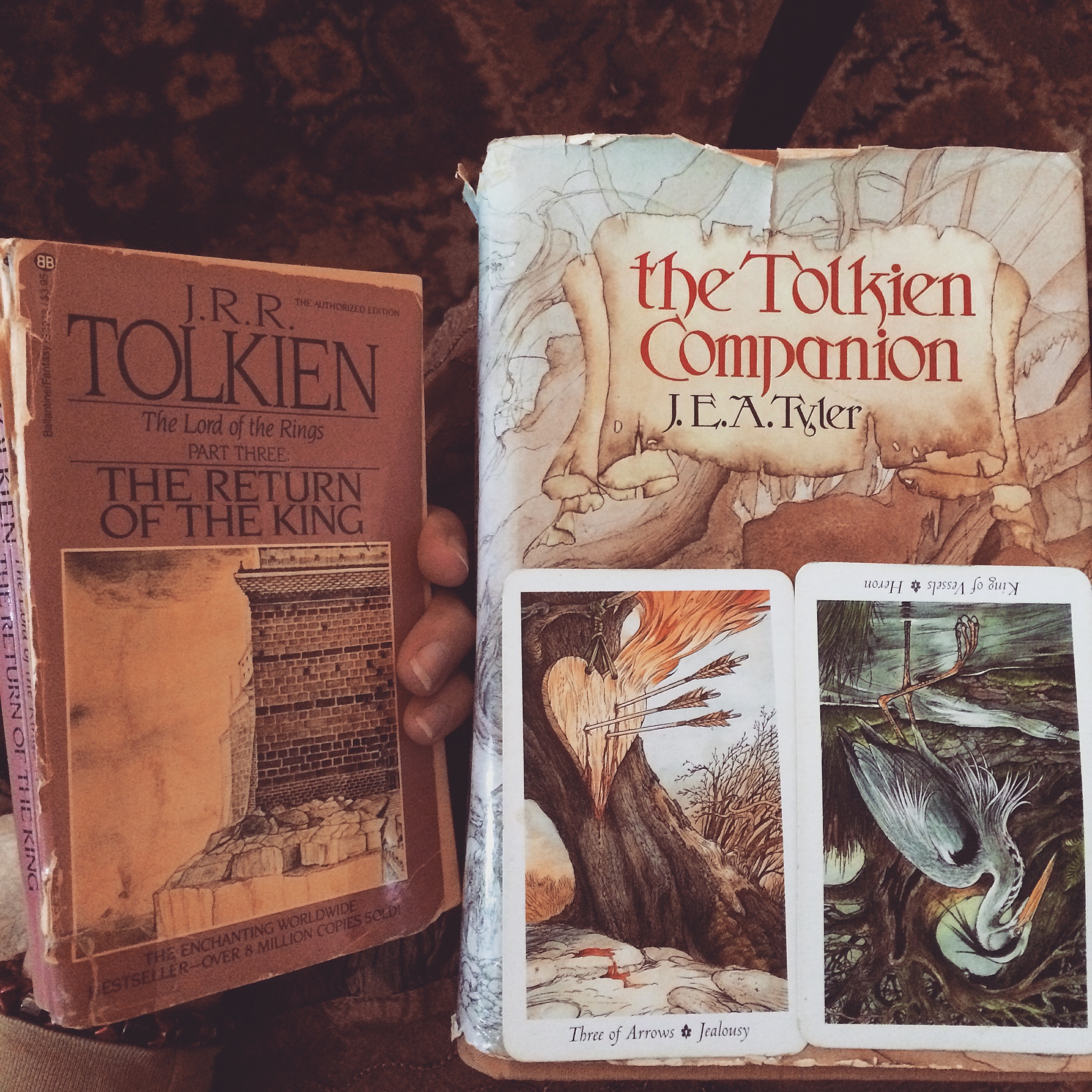 two tarot cards and two tolkien books